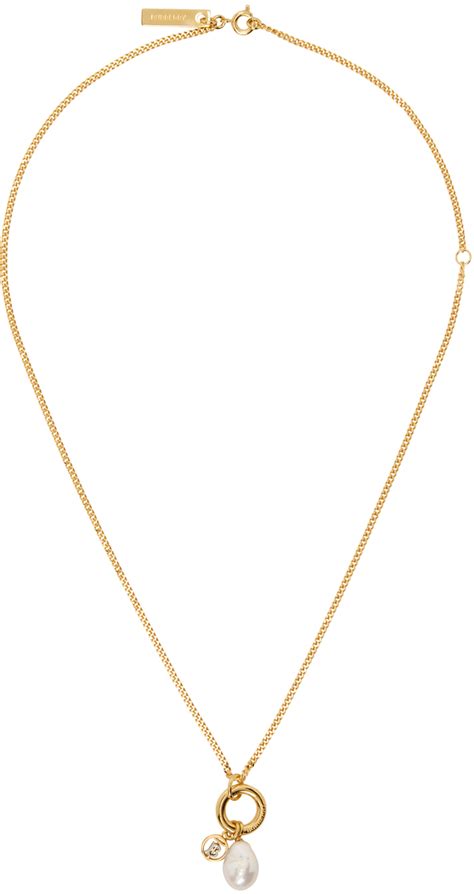 burberry gold bracelet|Burberry pendant necklace.